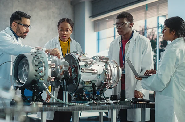 photo of Diverse Scientists Developing Innovative Technology in Industrial High Tech Facility