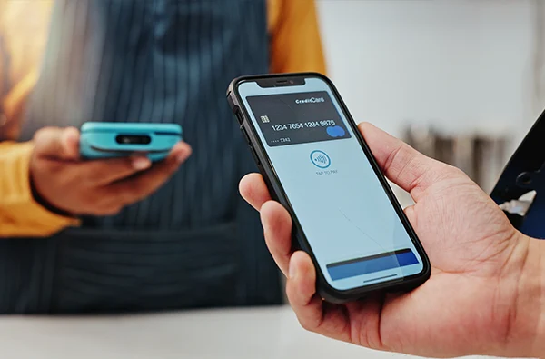 photo of customer, waiter and credit card on screen for mobile banking, payment and online transaction