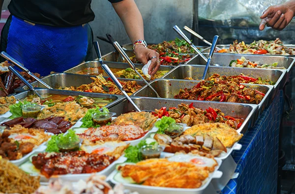 photo of assorted food dishes displayed in metal trays