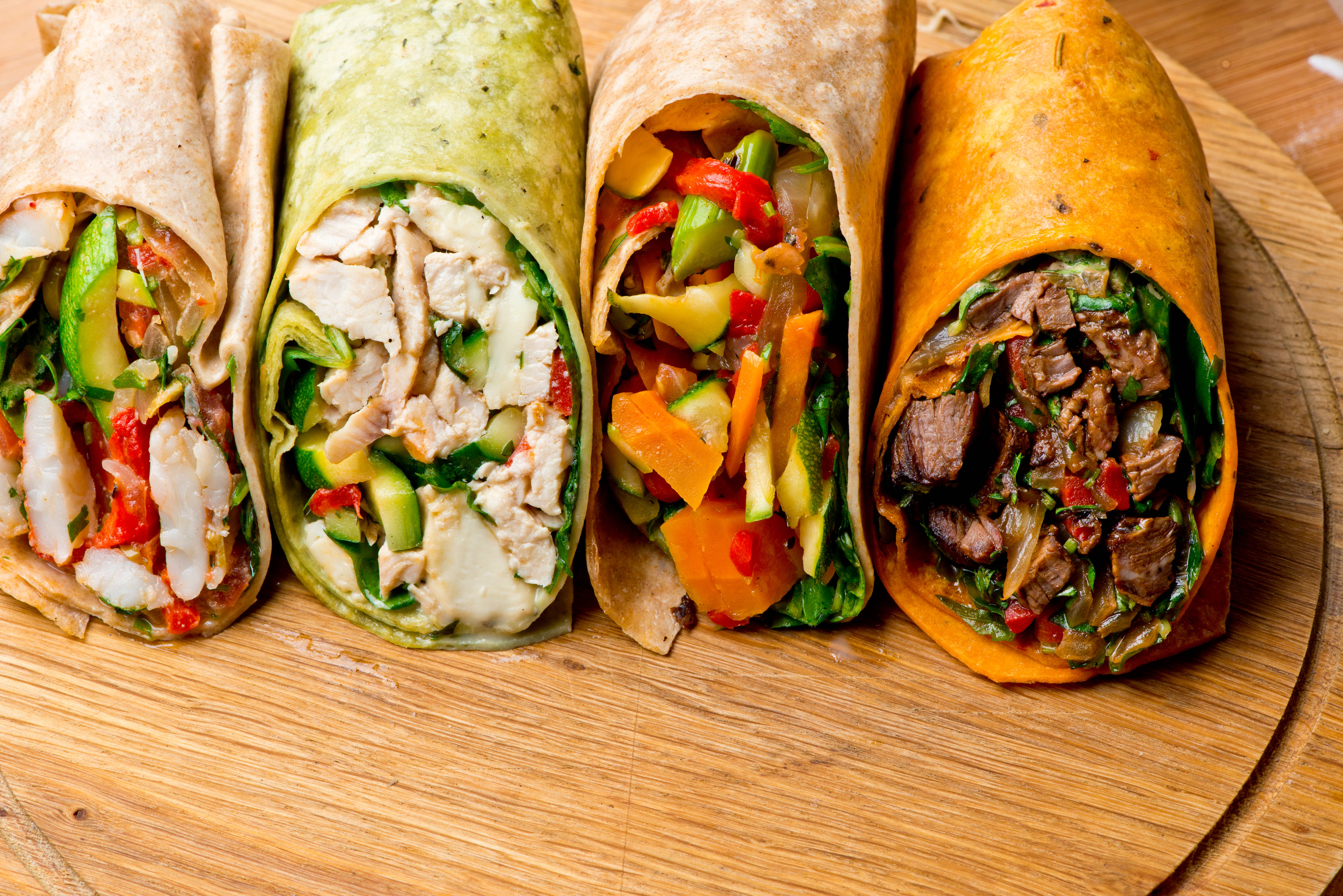 Array of different wraps displayed on cutting board