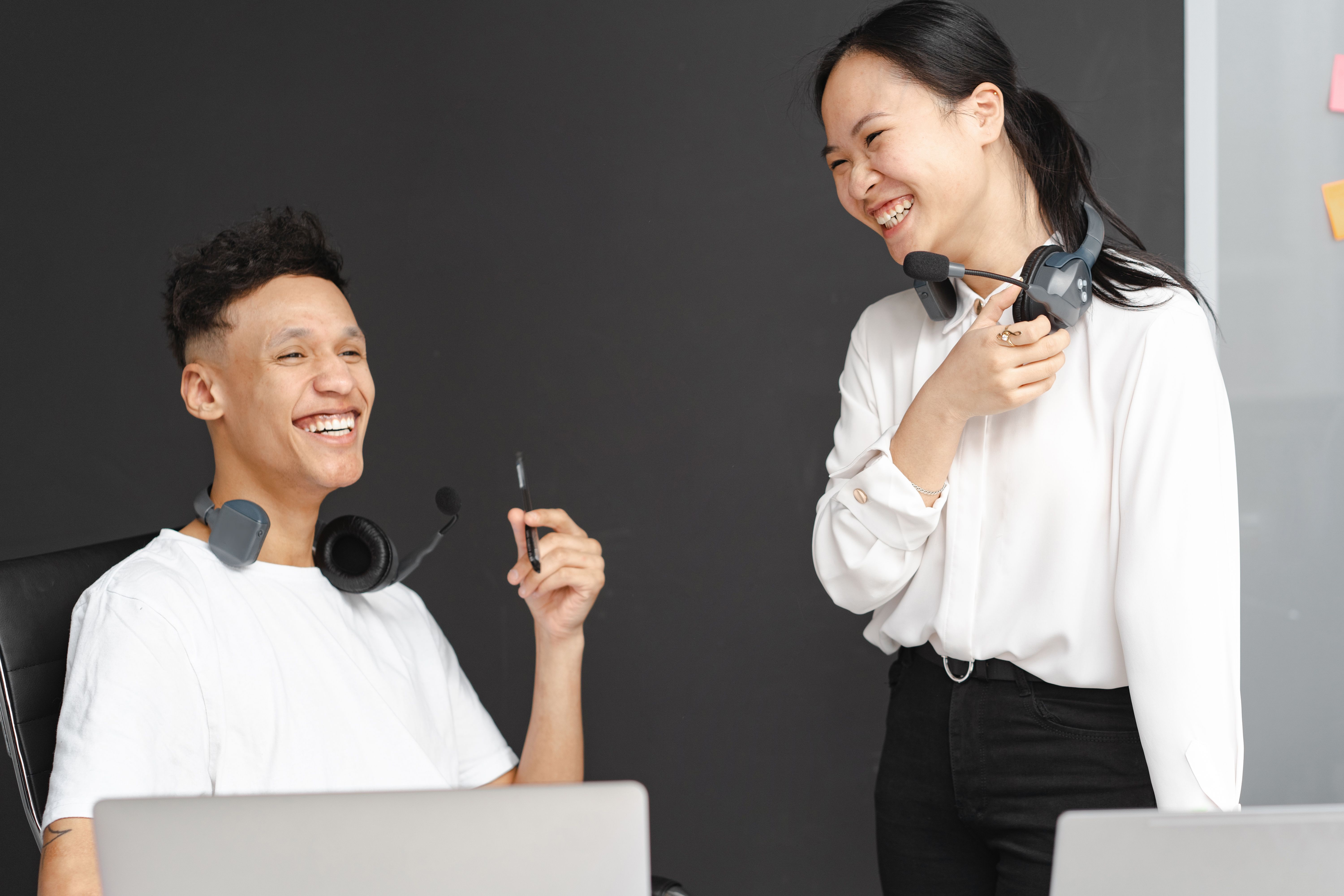Two employees laughing with each other