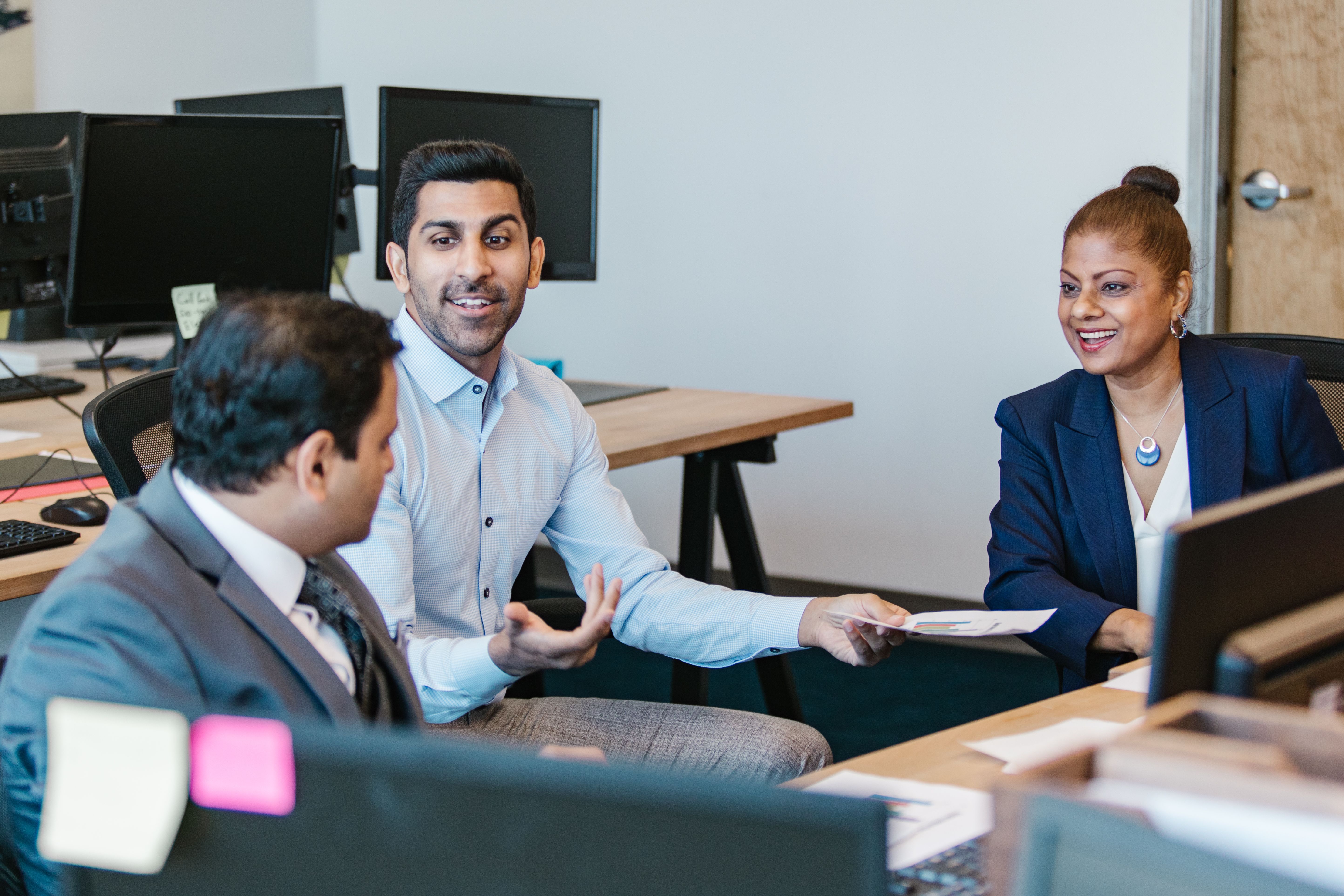 Employees talking to each other in the office