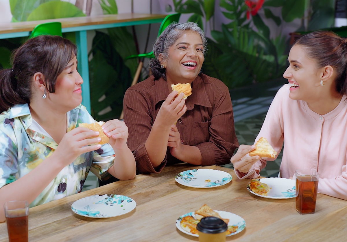 3 employees eating corporate catering