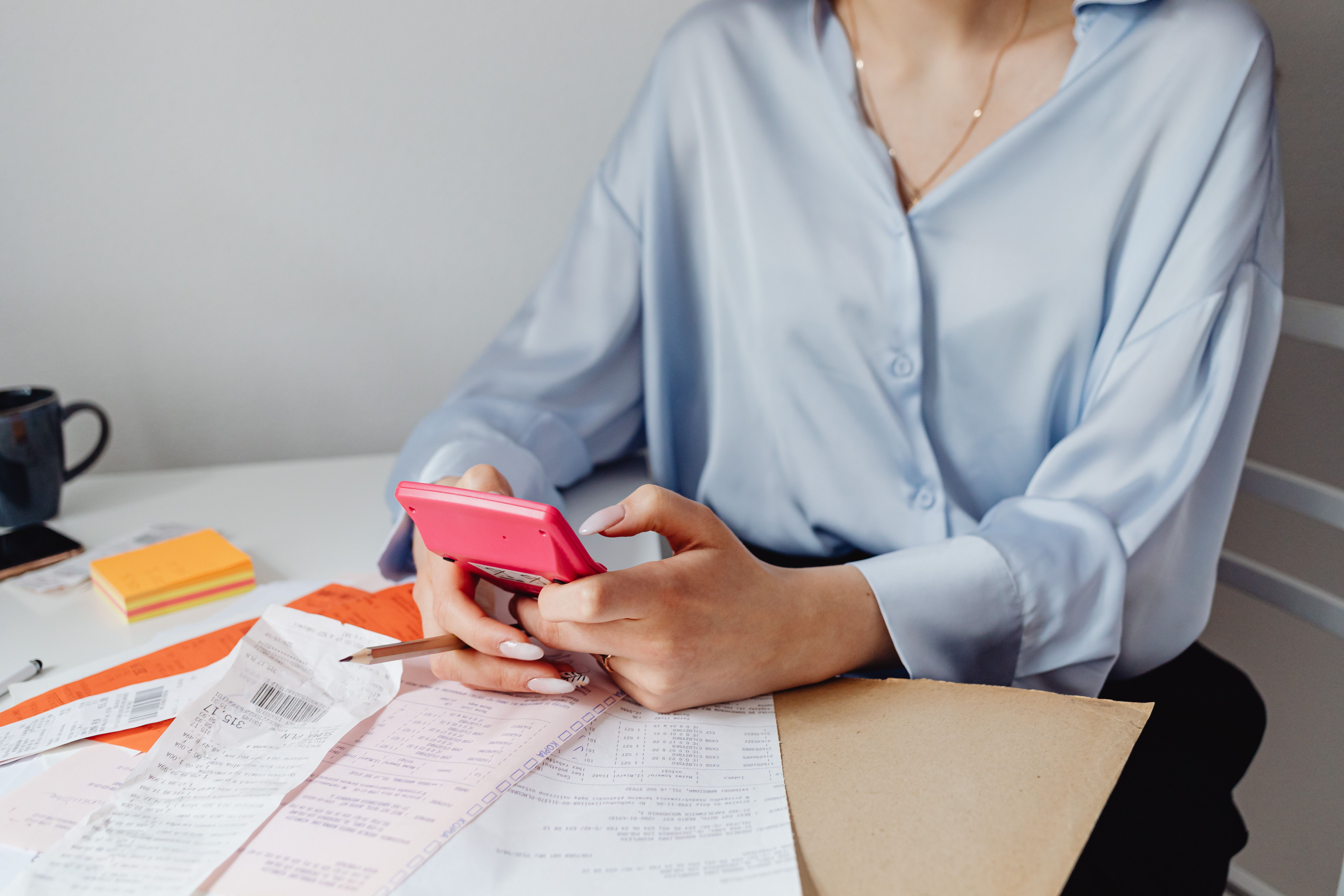 Woman sitting at desk working on a budget