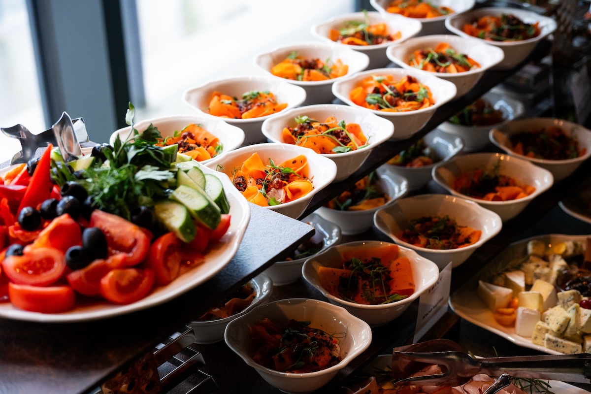 Catering spread of plated dishes ready to grab