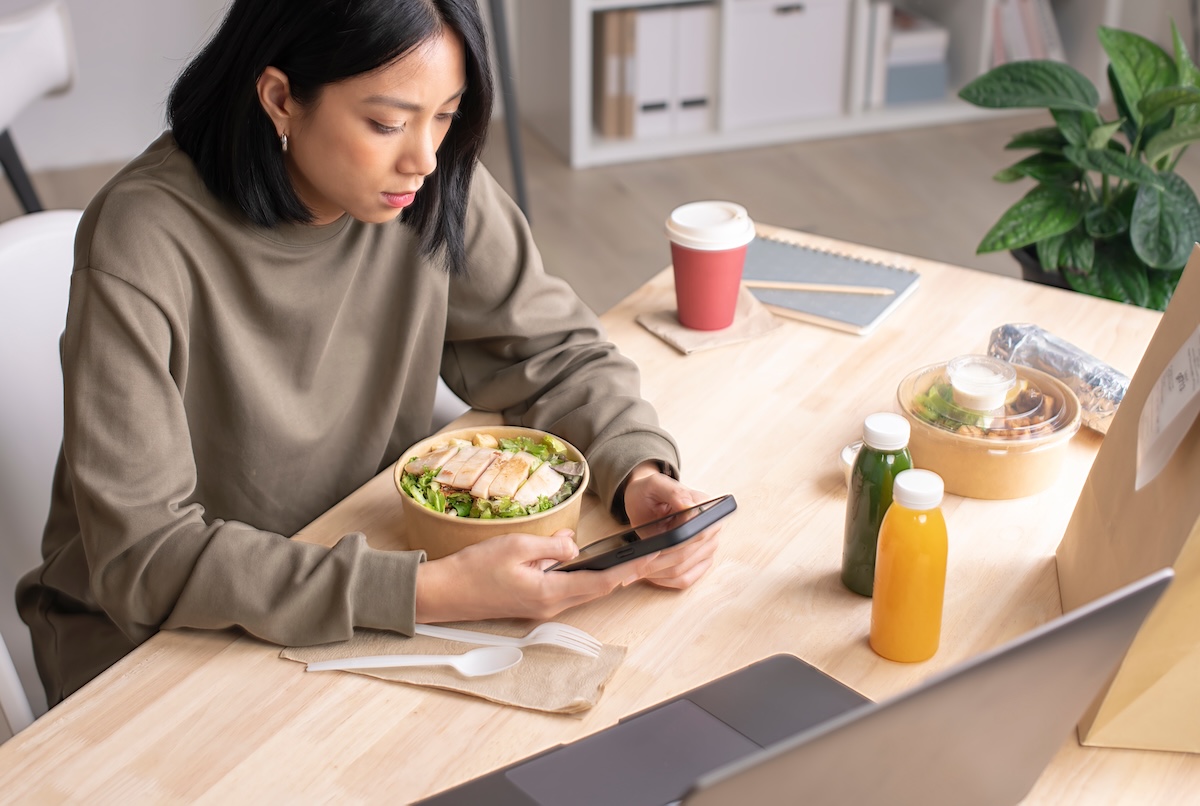 Employee enjoying delivery food in the office