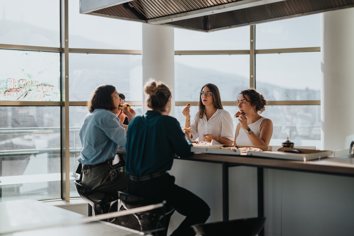 Employees eating lunch together