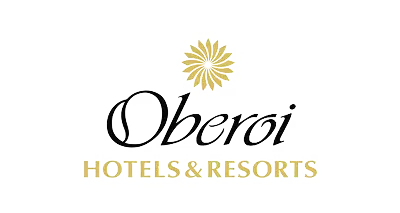 Logo of Oberoi Hotels & Resorts featuring a golden sun symbol above the name in elegant black typography, with 'HOTELS & RESORTS' in a bold gold font, ideal for branding and recognition.