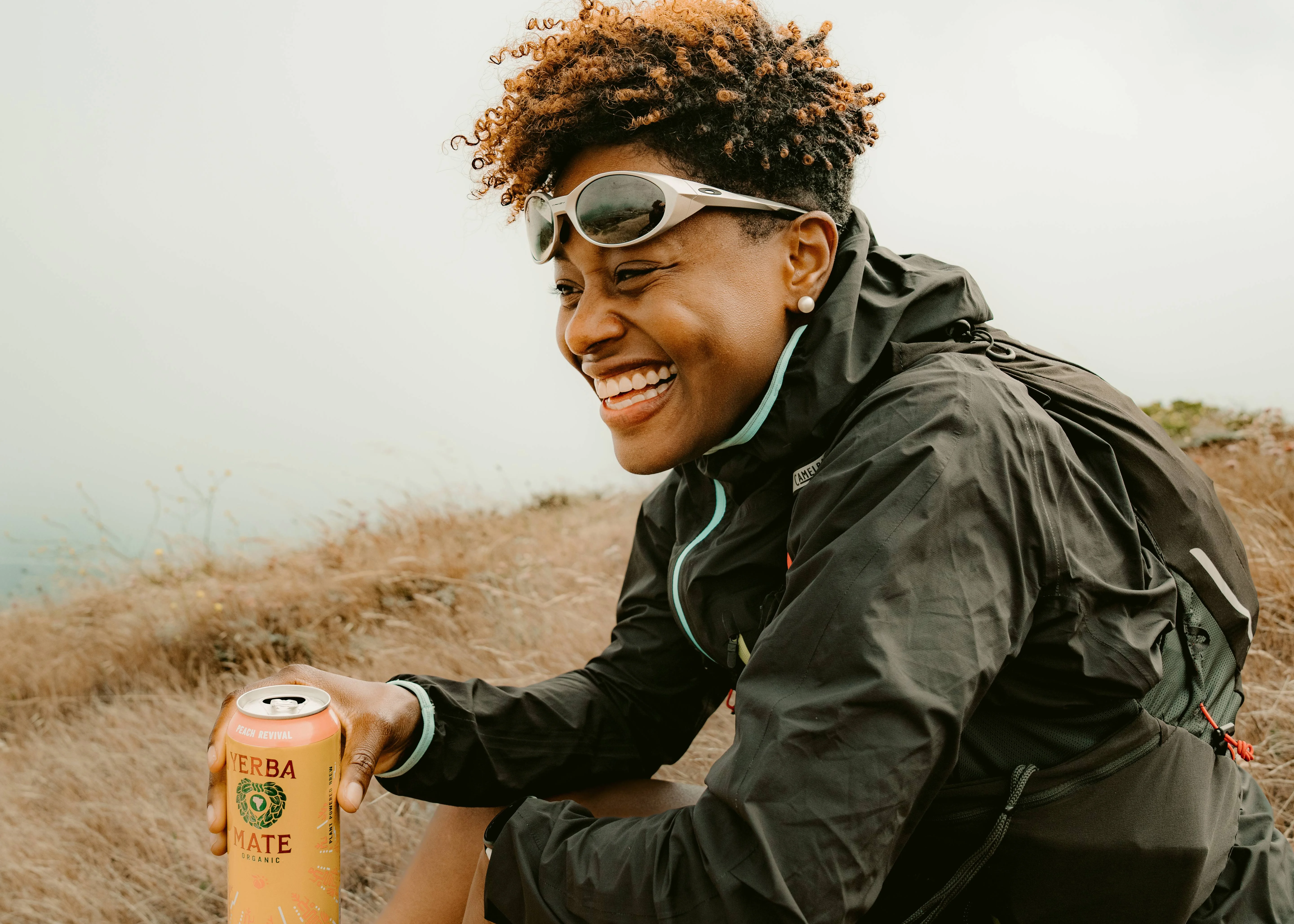 Model Laughing holding Can Drink
