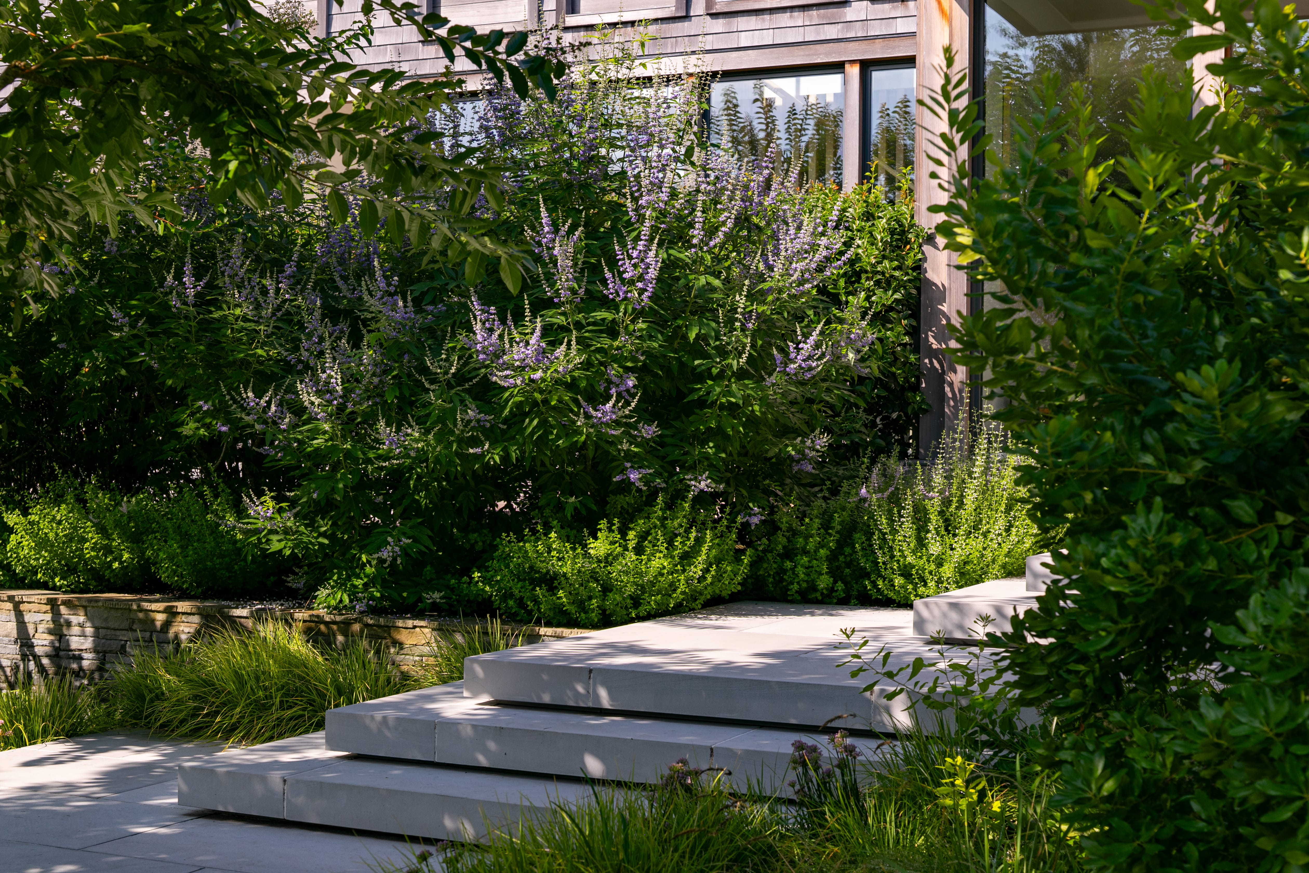 Outside picture of Sag Harbor 109 Glove with the gardens and the staircase entrance