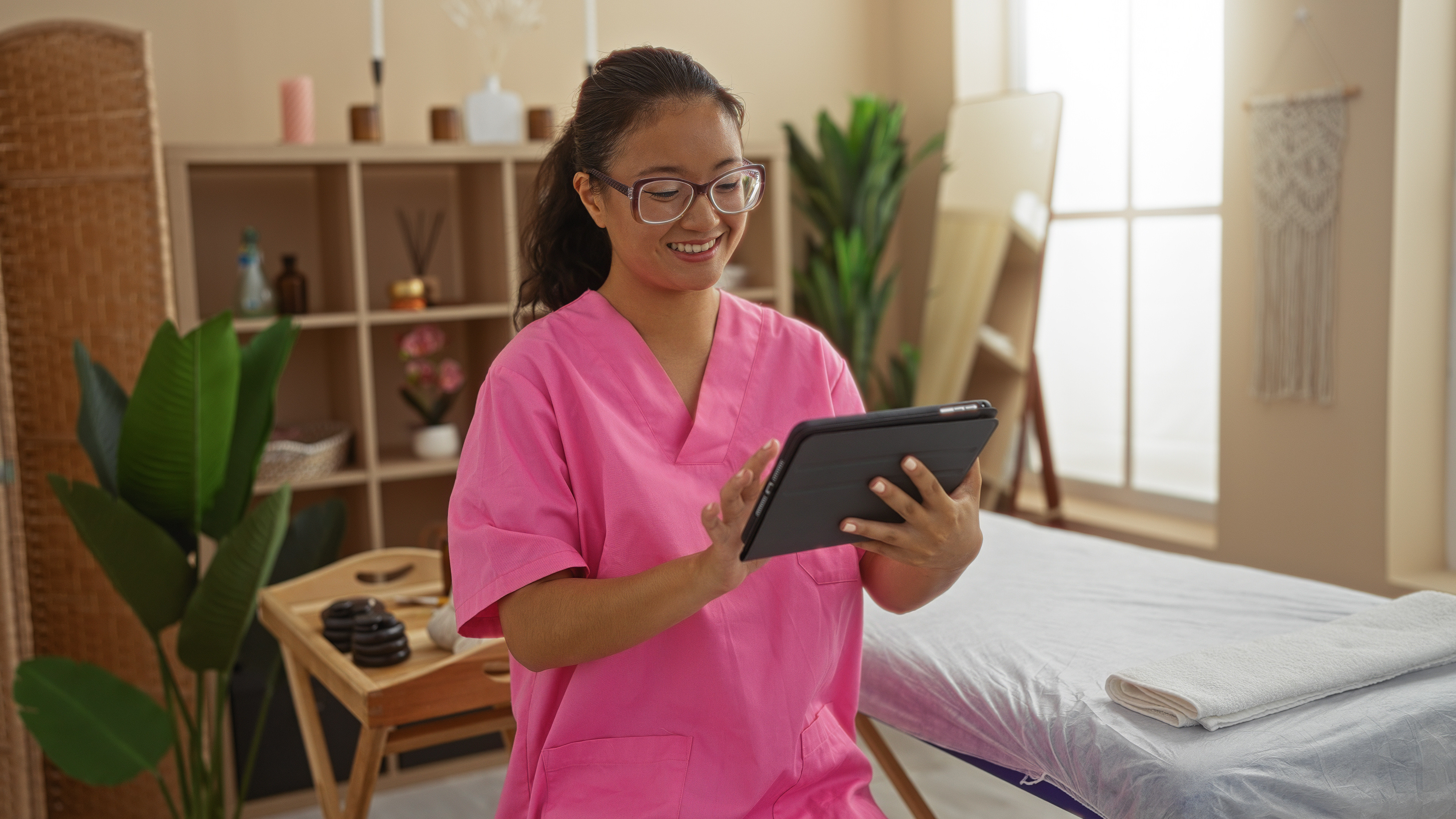 Spa brand digital marketing materials displayed on a laptop and smartphone screen