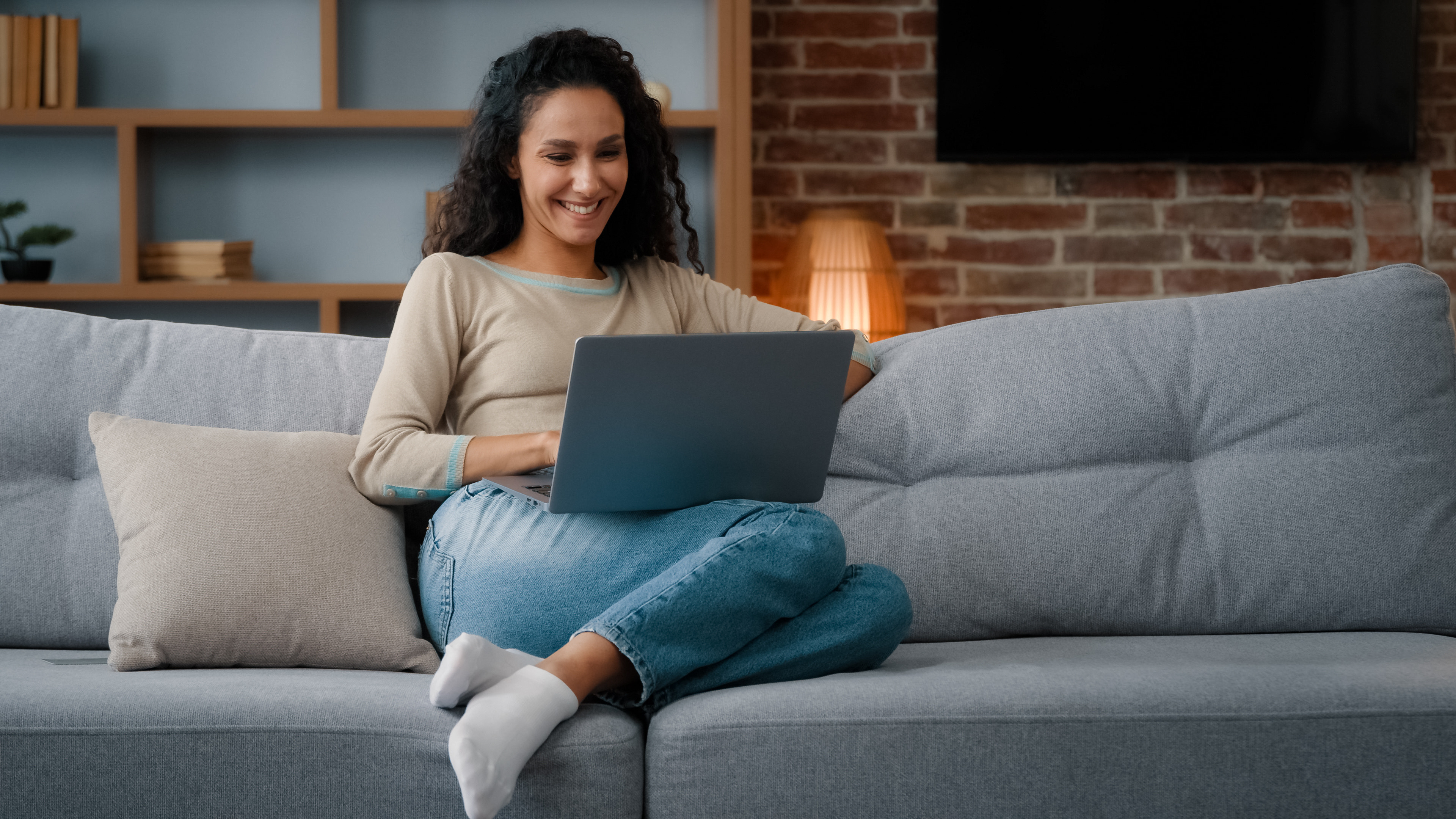 Guest using a tablet to book a luxury spa appointment online from home