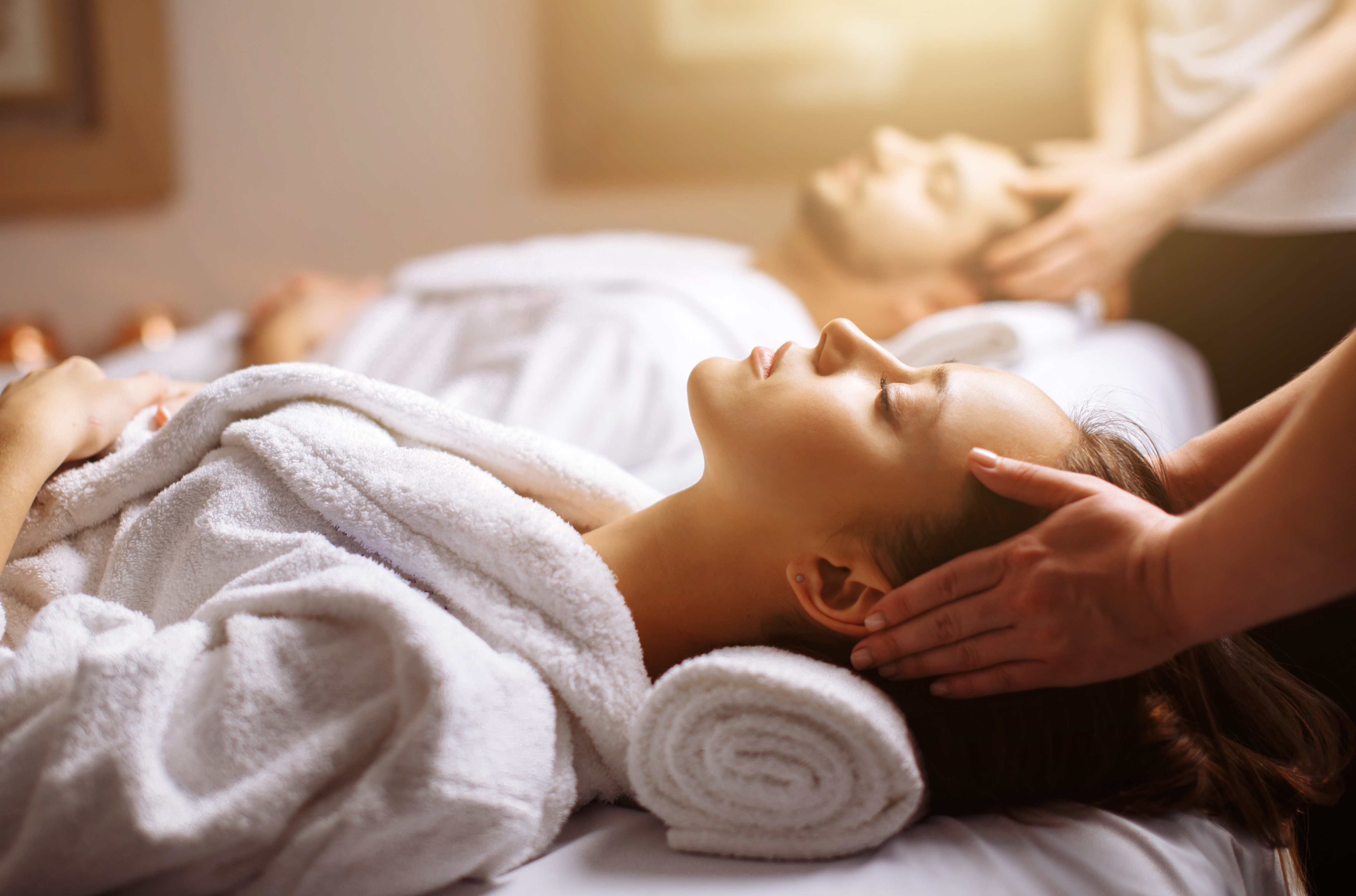 Wellness professional in a serene modern spa setting representing 2026 industry trends