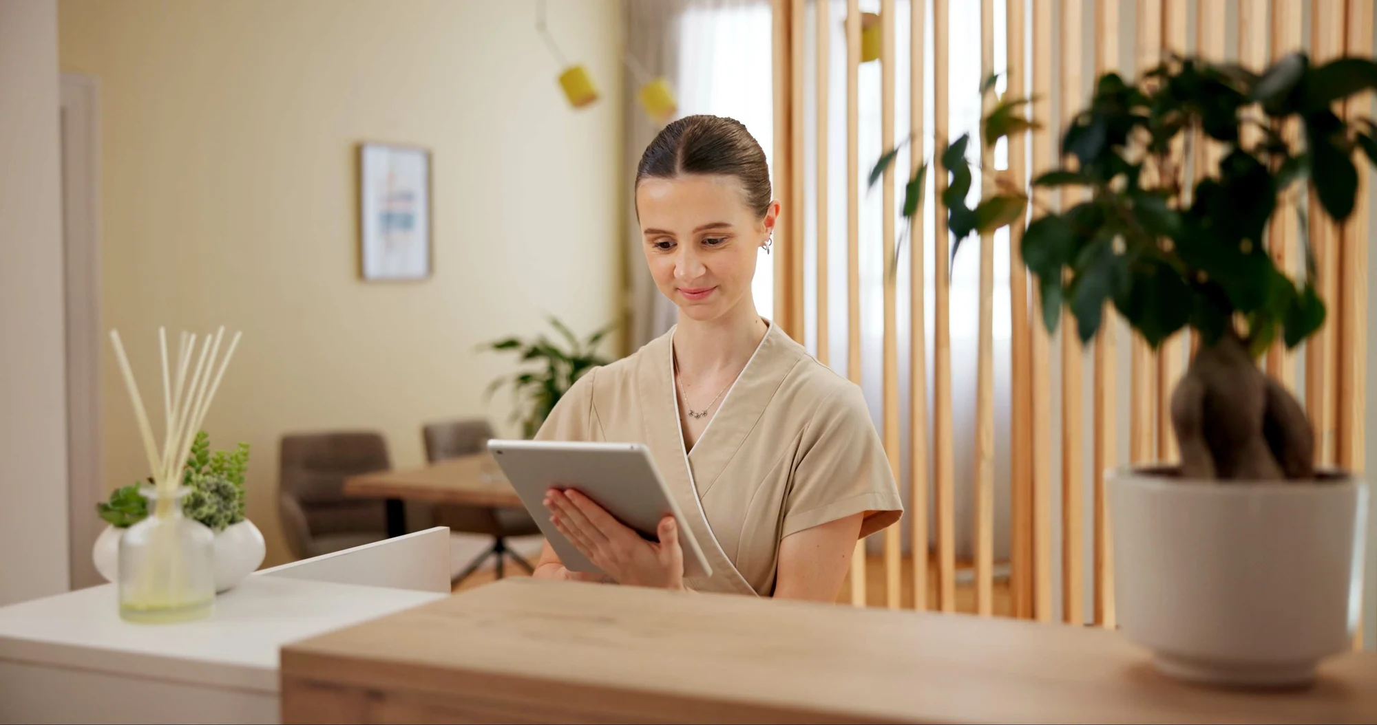 Spa director analyzing digital management data to drive business growth and efficiency