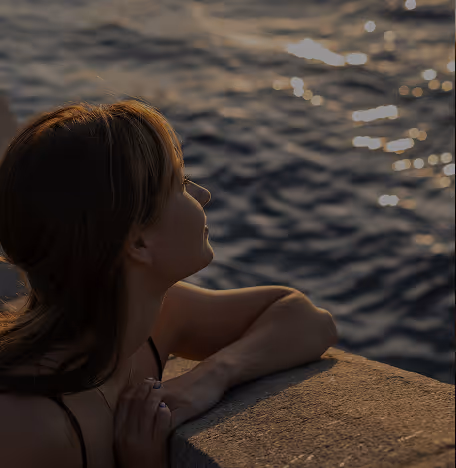 woman swimming looking into sunlight