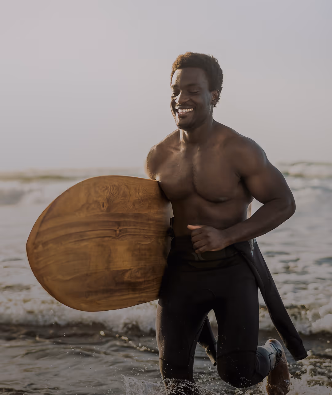 surfer running through water