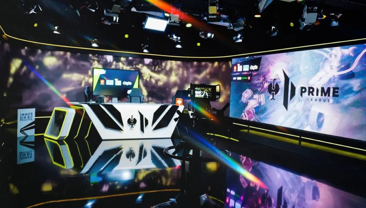 Esports stage with “Prime League” branding and large LED screens.