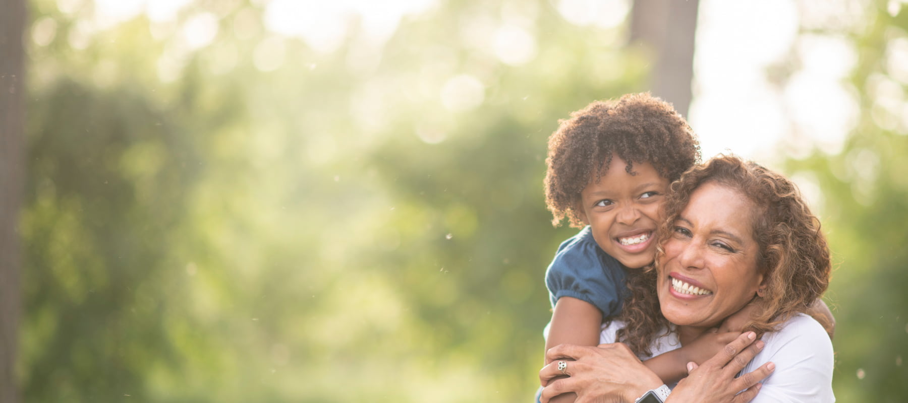 a mother and her child smiling