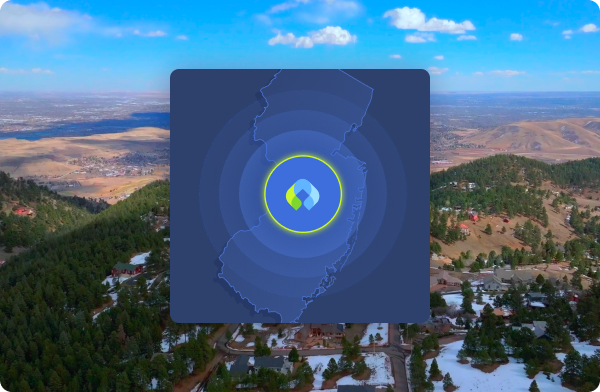 An aerial view of mountain foothills and Front Range cities in Colorado, centered with a blue map overlay. The overlay features concentric circles radiating from a hospital location with the Canopy logo centered within it.