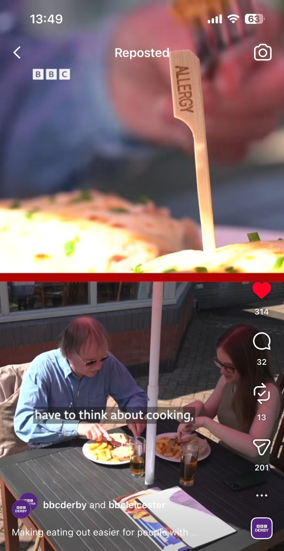 Two people sitting outdoors at a table with plates of food and drinks under an umbrella, with a food label stick marked 'ALLERGY' in close-up.