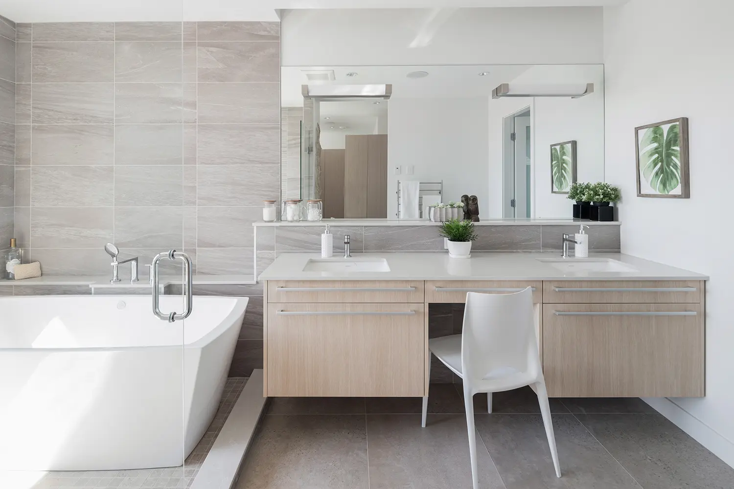 bathroom vanity with double sinks and a space to sit in between.

