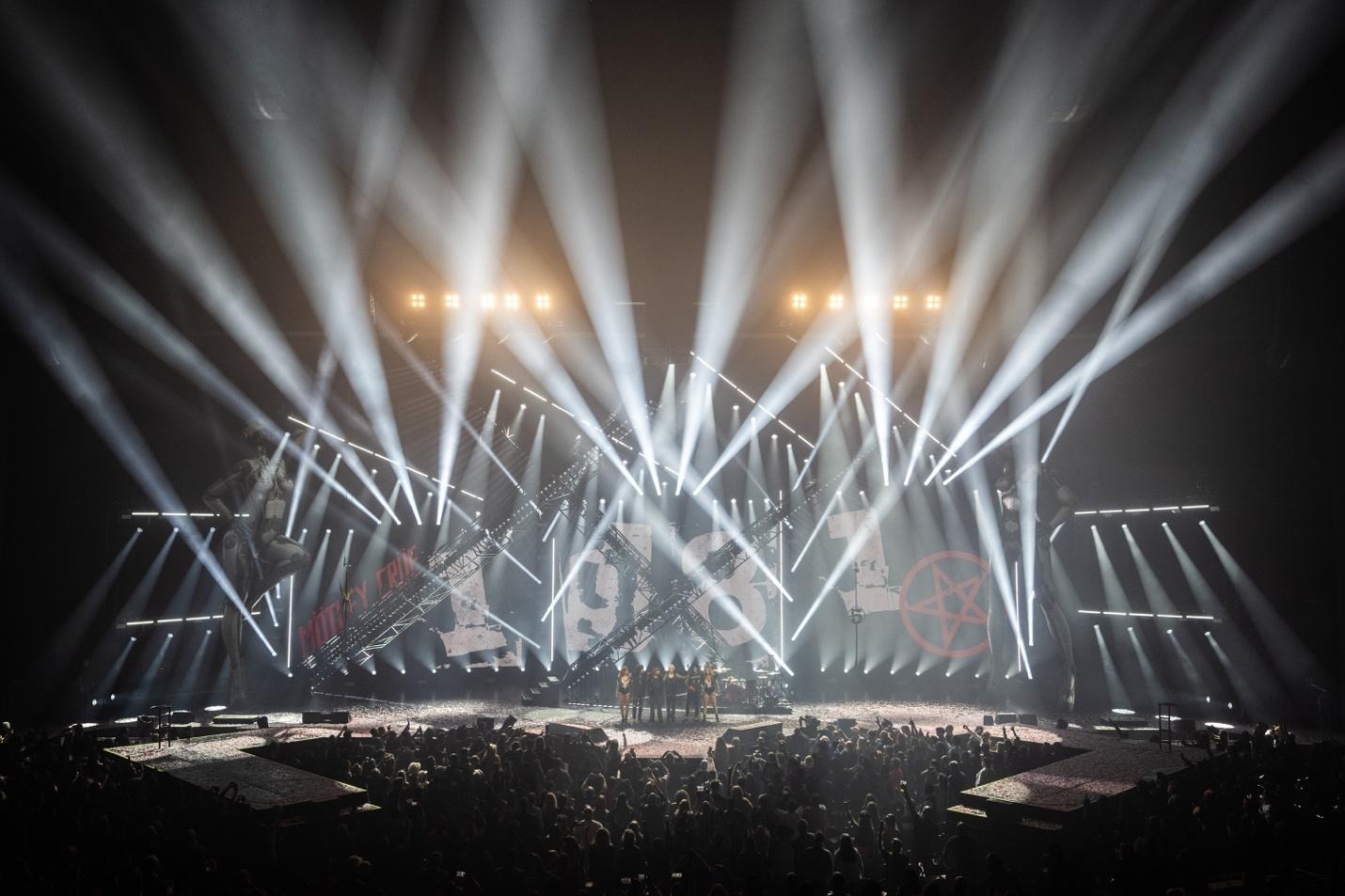 A stage with lights and a band on itAI-generated content may be incorrect.