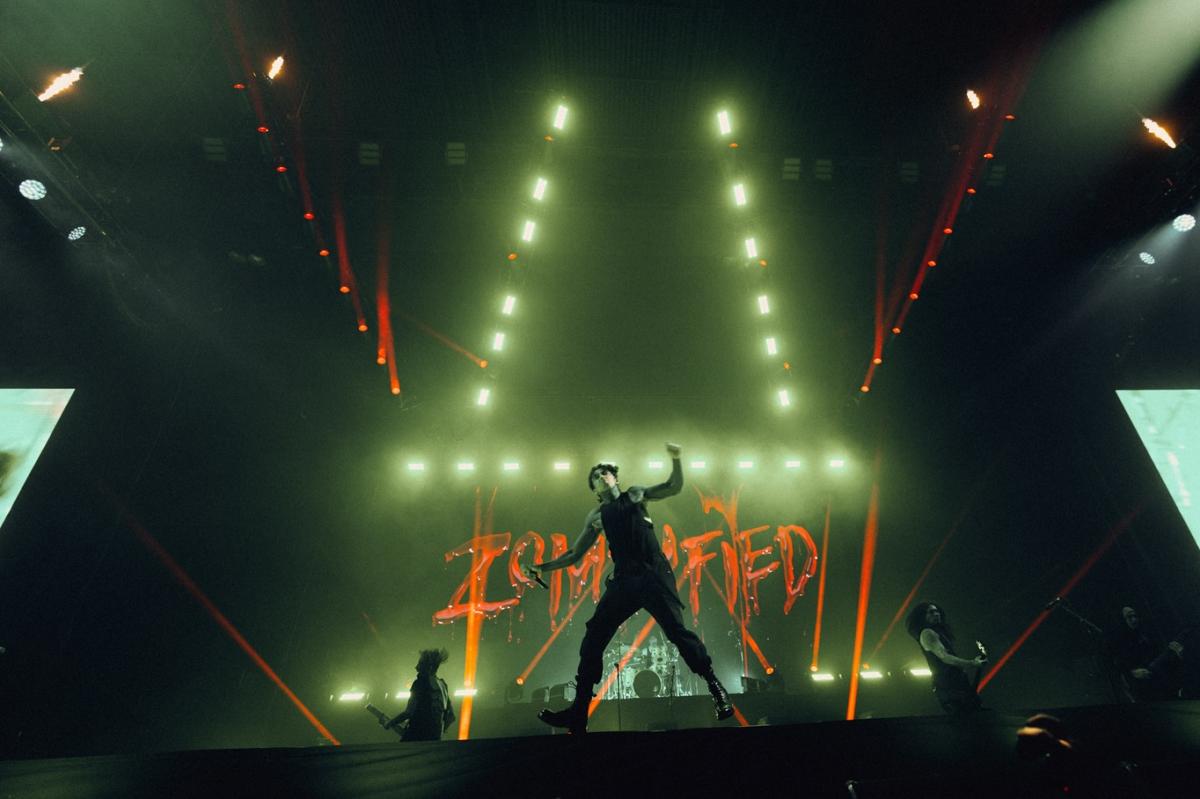 Falling in Reverse performing on stage at their concert featuring CHAUVET.