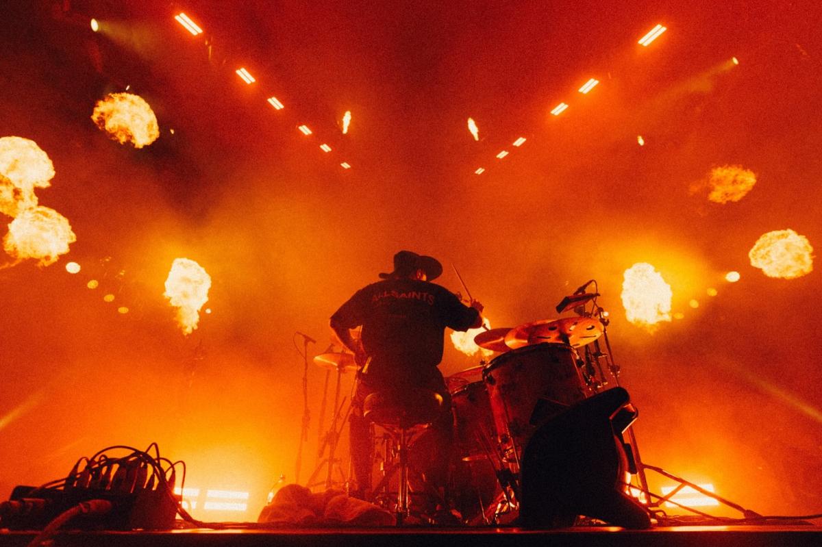 Falling in Reverse performing on stage at their concert featuring CHAUVET.
