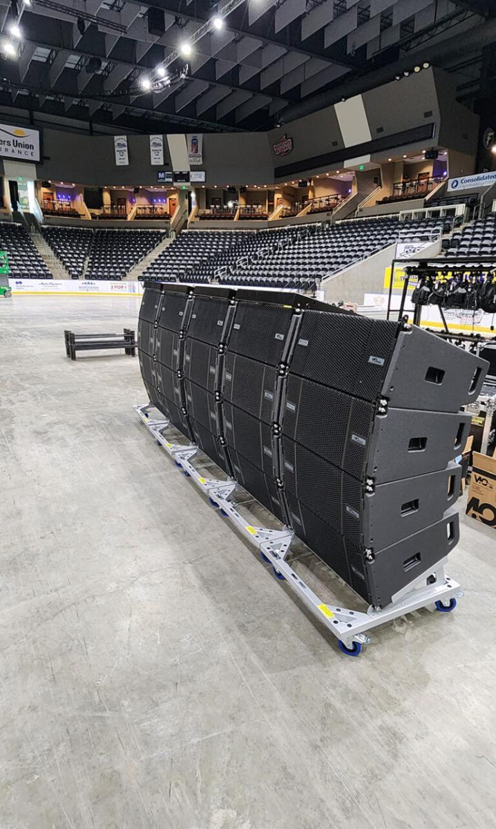 VIO L1610 medium-format line array systems on carts.