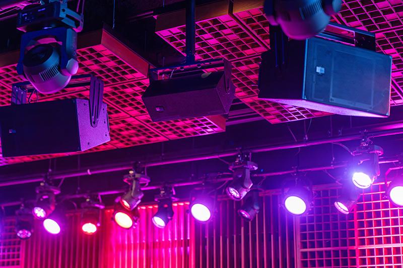 Speakers and lights hang above the stage at Garcias in Chicago.