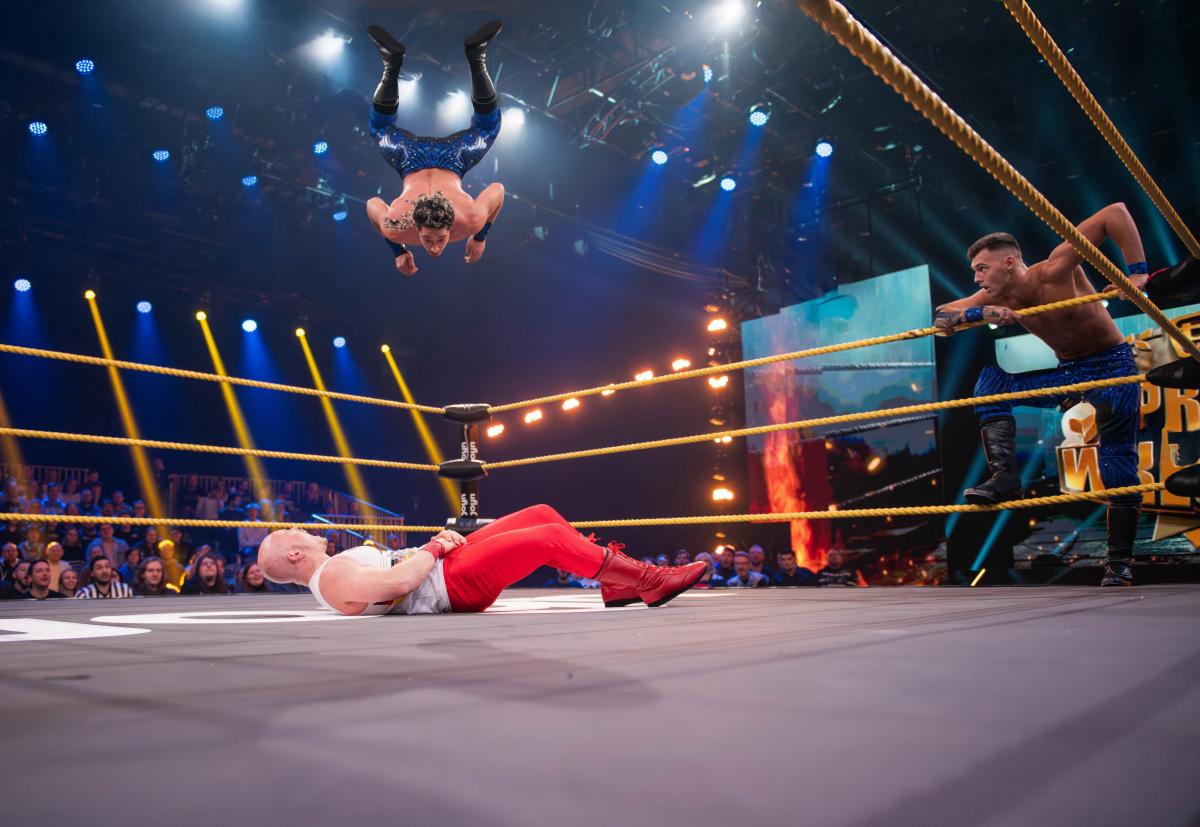 Promi Wrestling ring with a crowd in attendance watching two wrestlers in the ring.