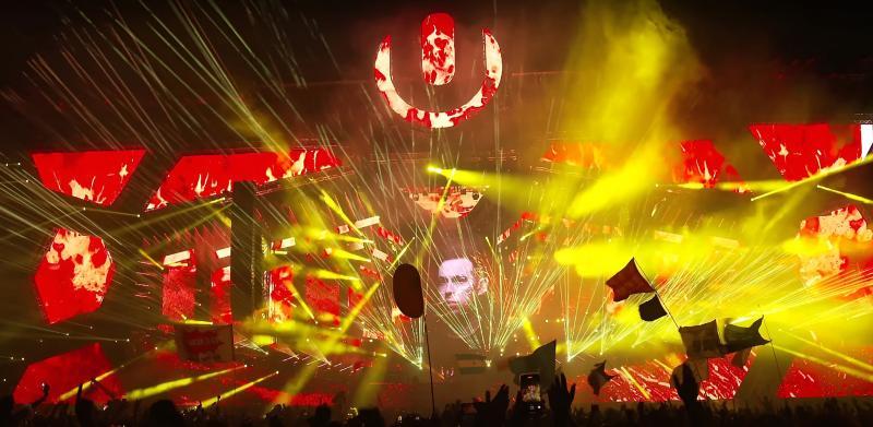 A stage at Ultra Music Festival Miami with yellow and red visual effects.
