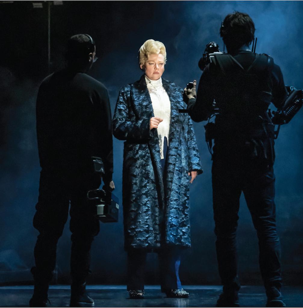 Actress Sarah Snook onstage with two technical artists