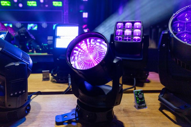 Small black light fixture emanating a purple hued light.