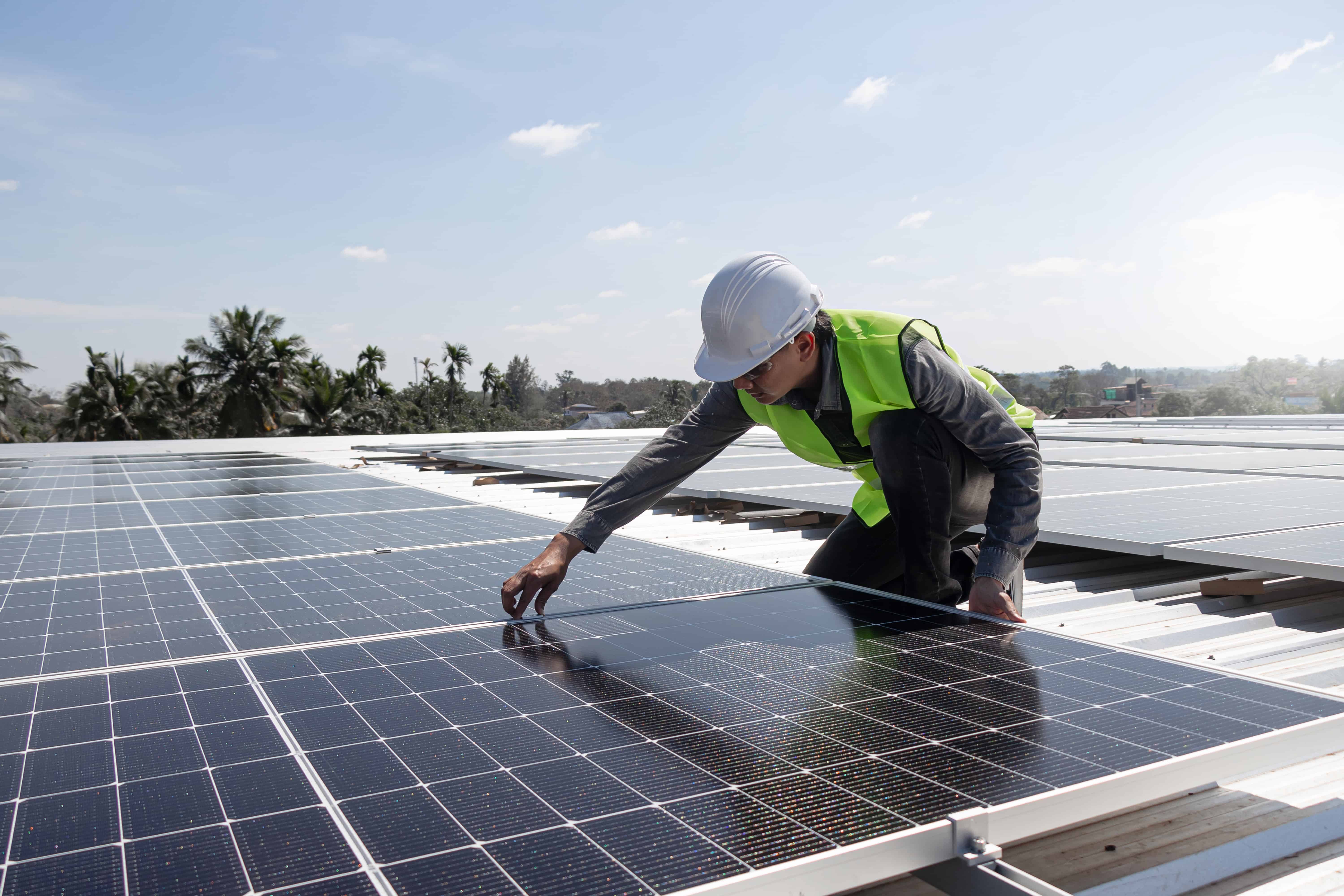 Installing solar panel on a roof.