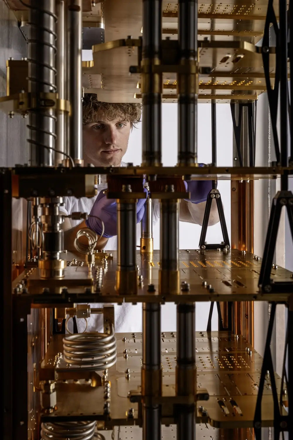 A Maybell technician easily accessing the inside of a dilution refrigerator for quick servicing