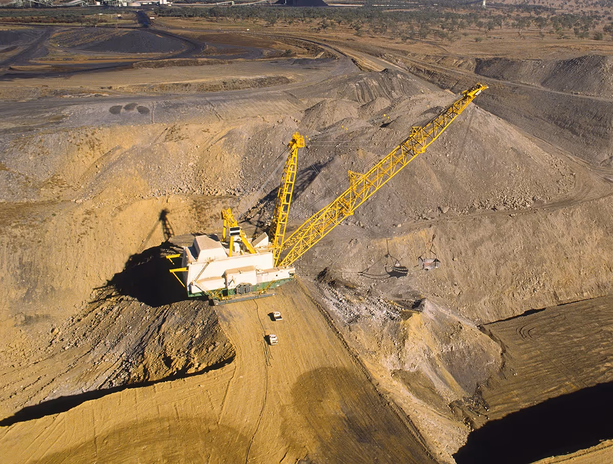Large yellow mining dragline excavator can operate efficiently with quality lubricants