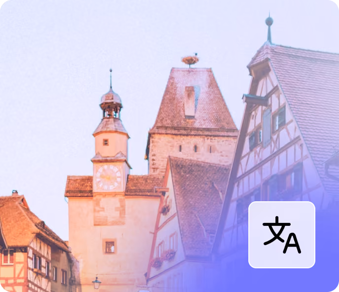 Historic half-timbered buildings and a clock tower in a European town at dusk.
