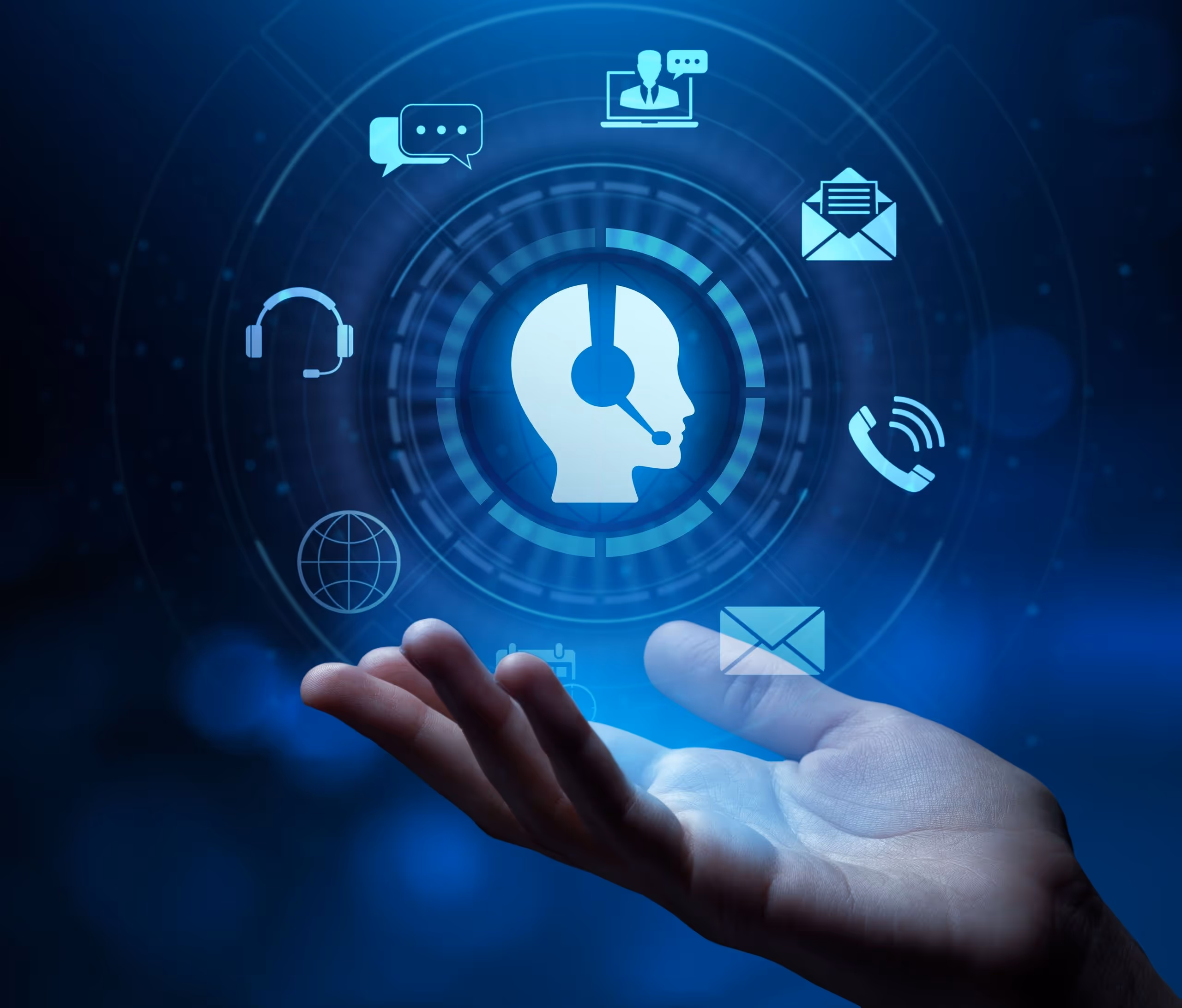 Hand with floating blue icons representing customer service communication, including headset, chat bubbles, phone, and email.