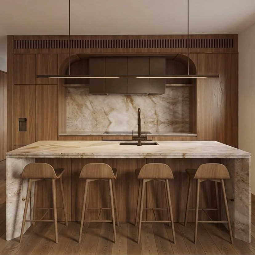 Walnut kitchen with a marble island and arched rangehood
