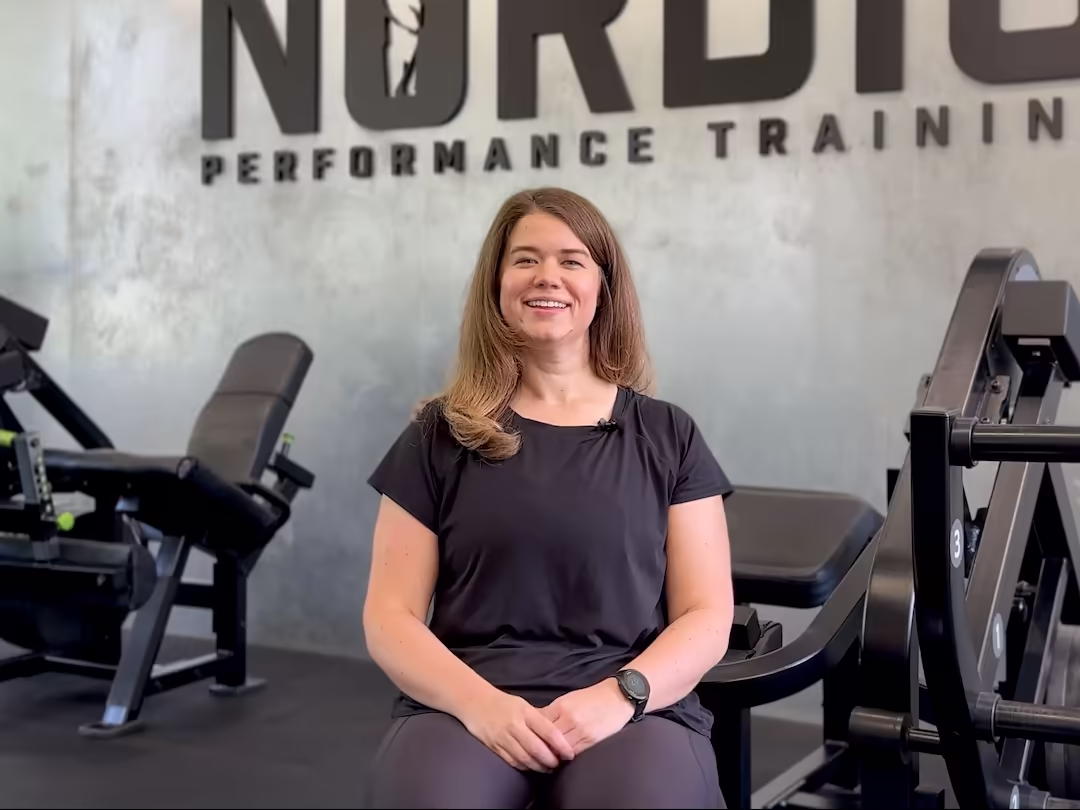 Image from Sarah’s client testimonial video at Nordic Performance Training in Copenhagen — sharing her personal training experience and results in a private gym setting.
