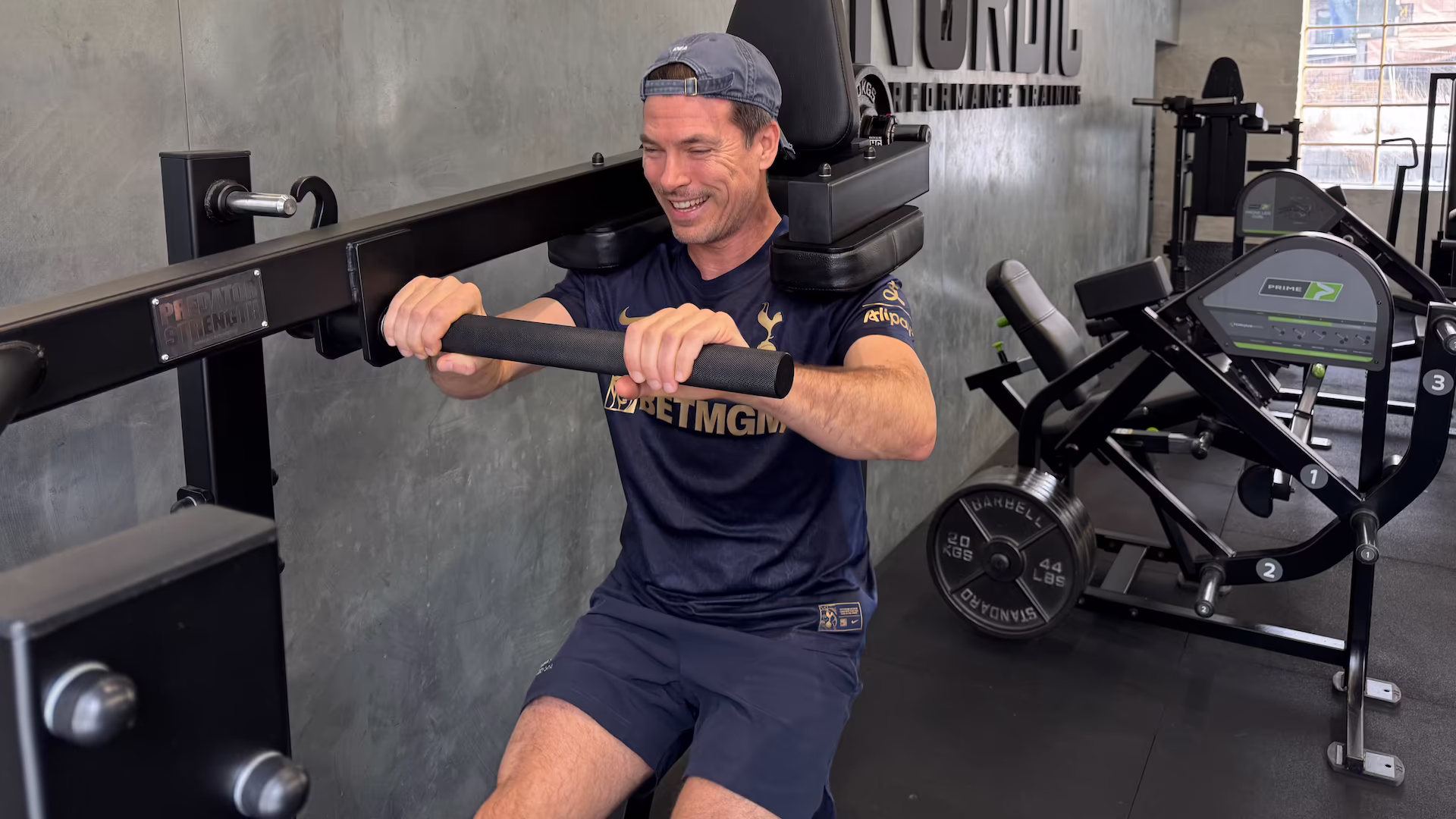 Client with a muscle strain performing pendulum squats at Nordic Performance Training during his rehab.