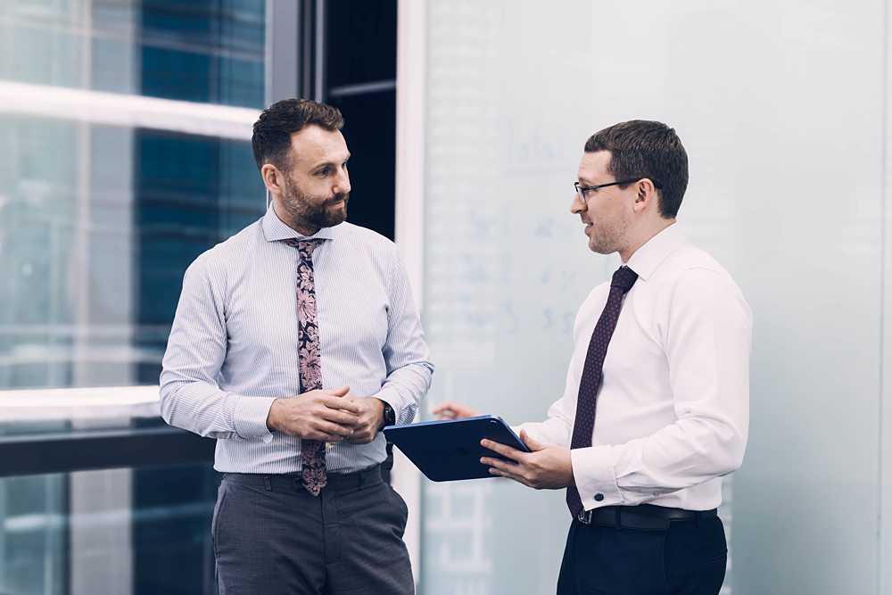 Jake Mowson & Michael Garcia Melbourne Capital Group having discussion.