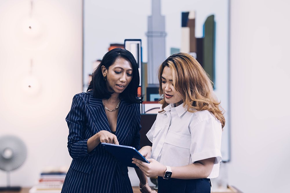 Farah Hashim & Melissa Lau Melbourne Capital Group having discussion