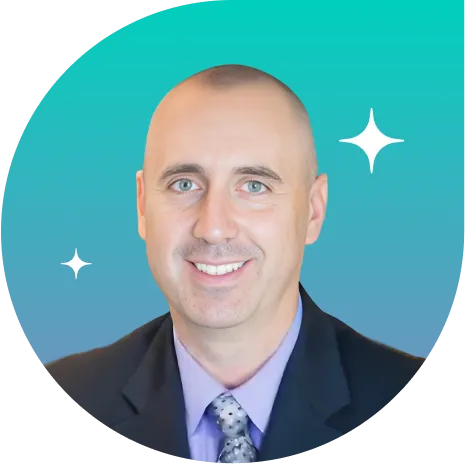 Portrait of Kevin Fliess, Chief Marketing Officer at Altum, smiling in a suit and tie against a teal-blue gradient background with sparkles.