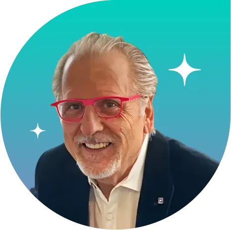 Neil Anderson, CMO at Tourmo, smiling in a professional headshot with red glasses and a teal background.