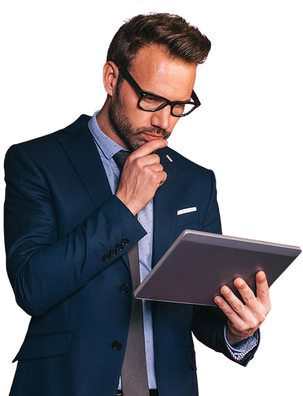 A man in a suit looking at a tablet.