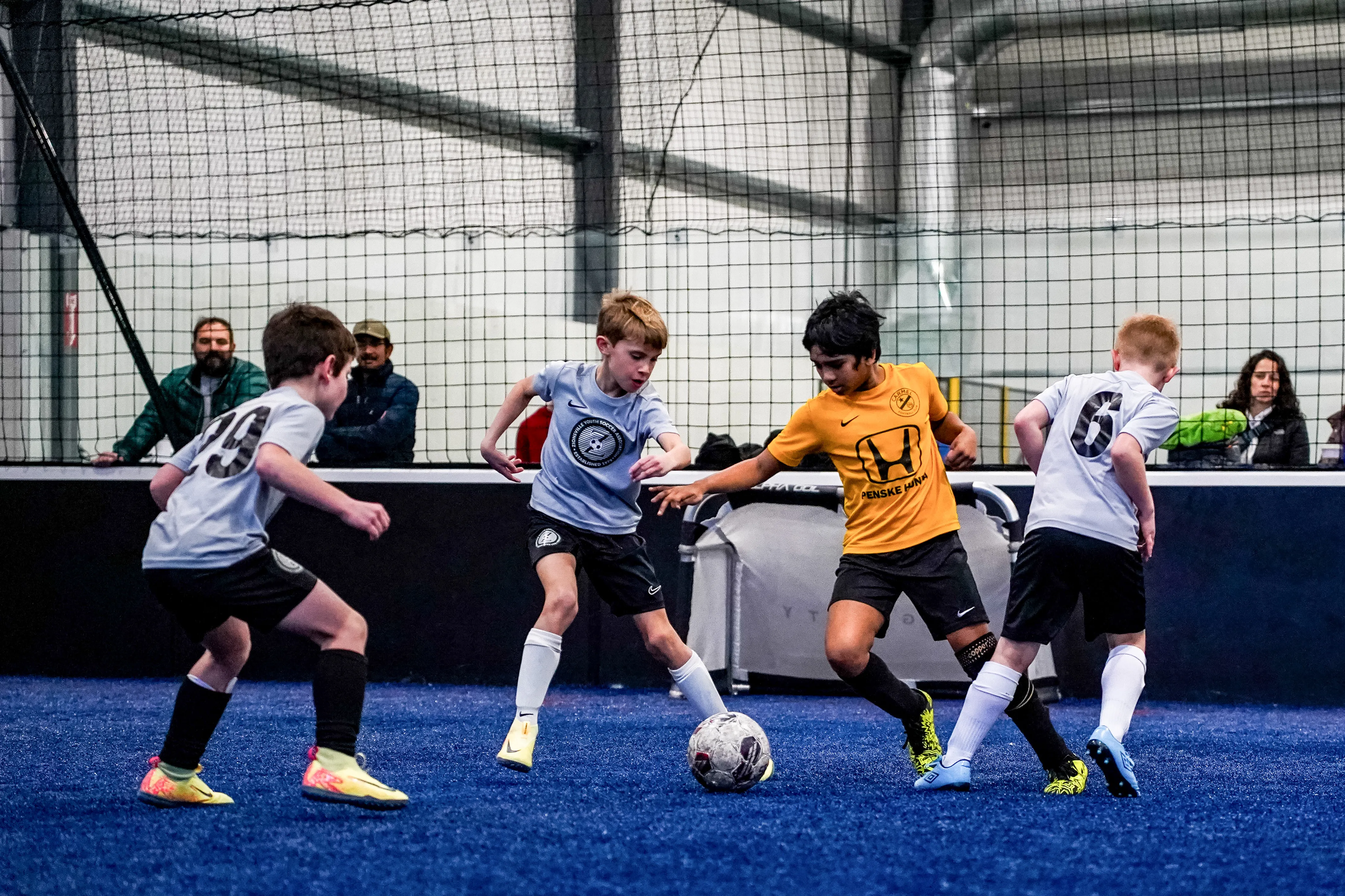 Youth soccer players competing in an indoor tournament at Sogility