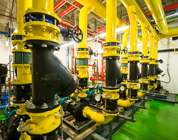 Yellow industrial piping system with control valves