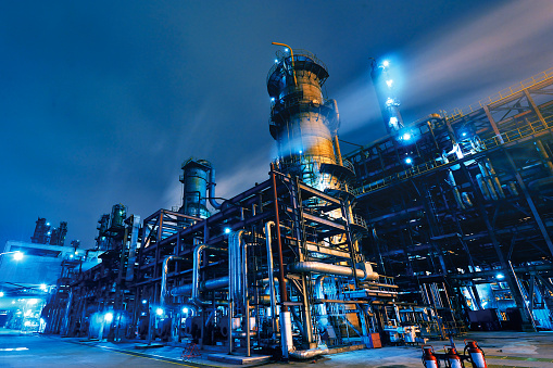 Chemical processing plant with towers and piping systems